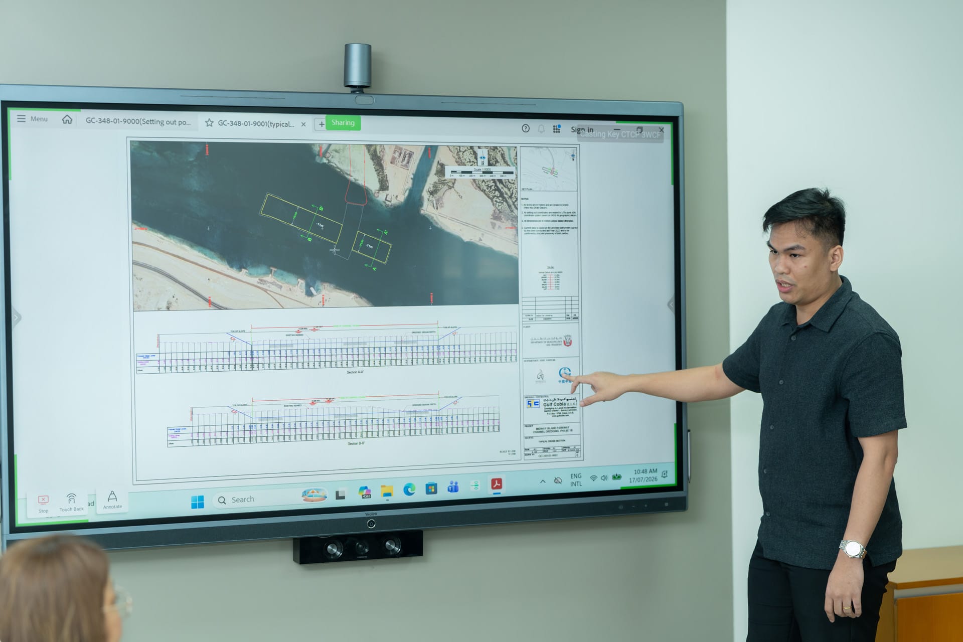 Dredging channel drawing on screen with Gulf Cobla title block and a presenter pointing at it.