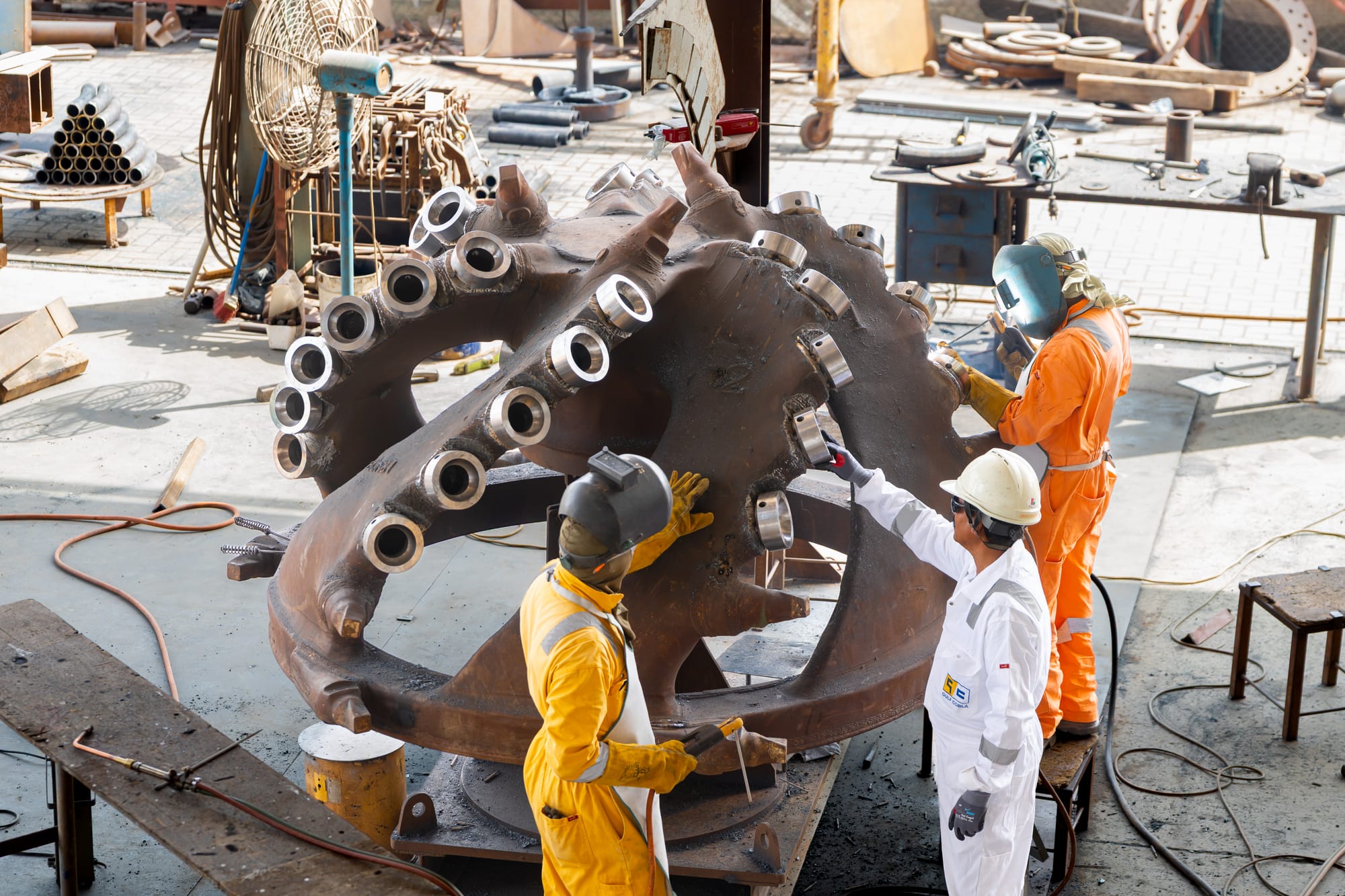 Gulf Cobla crew refurbishing a dredger cutter head in the yard.